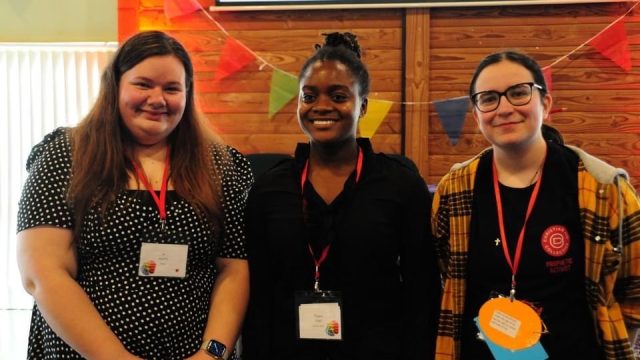 A photograph of Jo Harris, Philippa Osei, and Heather Moore taken at URC Youth Assembly 2023.  