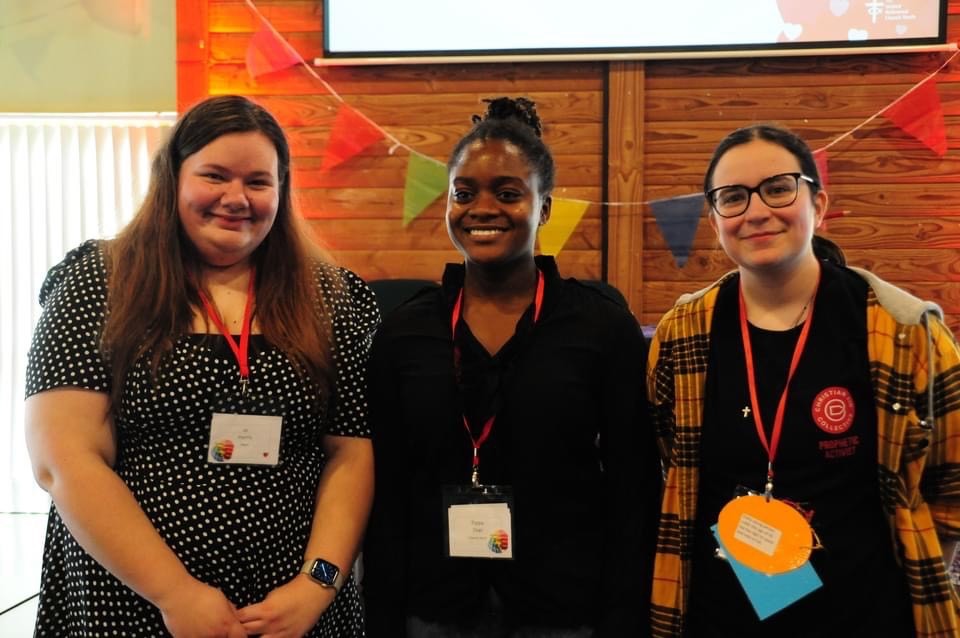 A photograph of Jo Harris, Philippa Osei, and Heather Moore taken at URC Youth Assembly 2023.